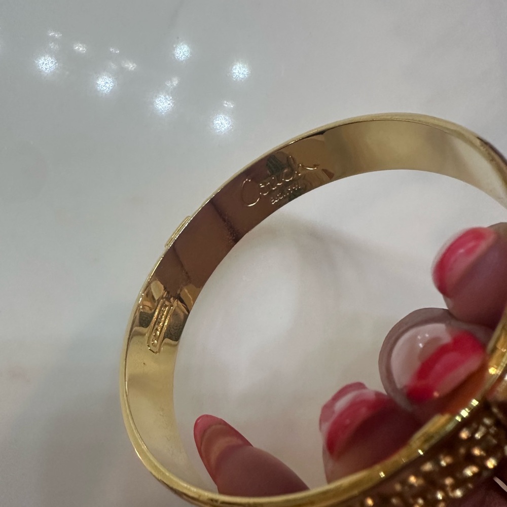 Coach Gold-Tone Signature Hinged Bangle Bracelet - Picture 2 of 2